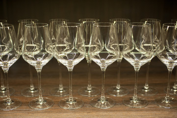Glasses for wine on a wooden table.