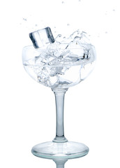 Splash from ice cube in a wine glass of water