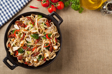 Whole-grain tagliatelle pasta with grilled chicken.