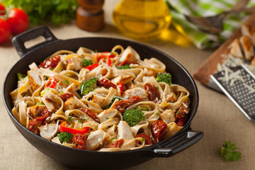 Whole-grain tagliatelle pasta with grilled chicken.