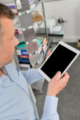 Designer holding a tablet