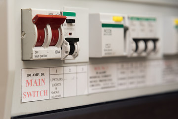 Close up of a MCB (Micro Circuit Breaker) on a UK domestic electrical consumer unit or fuse box - obrazy, fototapety, plakaty