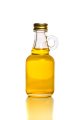Obraz na płótnie Canvas Small bottle with olive or sunflower oil isolated on the white background.