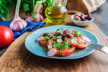 Fresh healthy salad with tomatoes, homemade dish