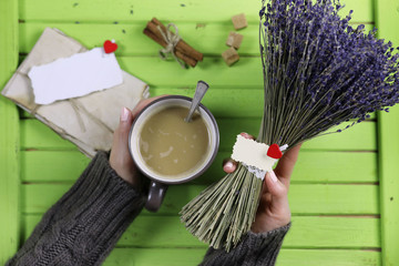 Girl drinking hot coffee and looks presented valentines