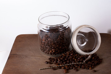 Coffee cup and beans on old kitchen table. Top view with copyspa