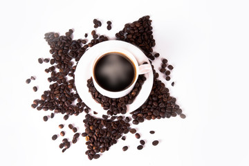 Coffee cup and beans on old kitchen table. Top view with copyspa