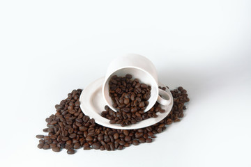 Coffee cup and beans on old kitchen table. Top view with copyspa