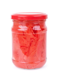 Pickled ginger in a glass jar on a white background