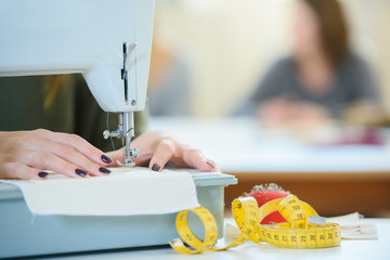 Woman using a sewing machine