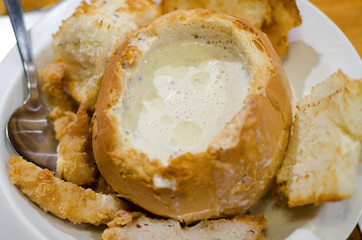Traditional Asian Malaysian dish - chowder mushroom creamy soup in bread bowl.