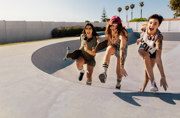 Laughing women climbing a skateboard ramp © Jacob Lund