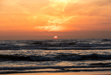 Scenic View Of Sea Against Orange Sky