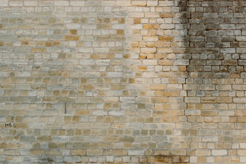 Old yellow brick wall for texture or background