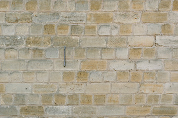 Old yellow brick wall for texture or background