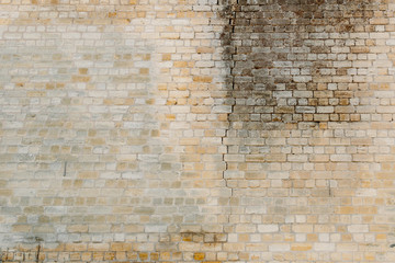 Old yellow brick wall for texture or background