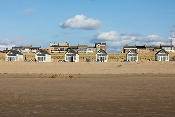 Row white beach houses at the Dutch coast in Katwijk, Netherlands
