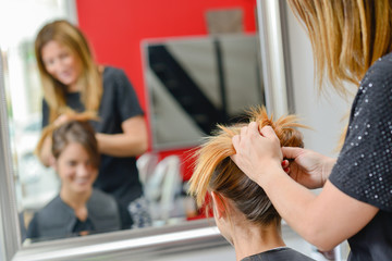 Having her hair styled