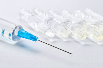 syringe with a drop