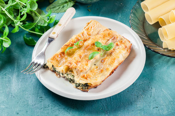Portion of cannelloni stuffed with spinach