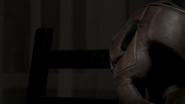 Boxing-gloves and helmet. Boxing helmet and gloves are on floor.