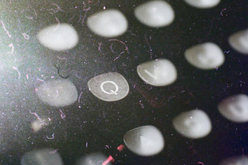 Q one letter in focus on an old typewriter