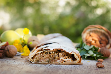 Strudel with apples. Summer breakfast in nature.