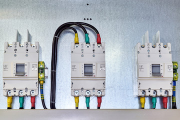 There are three power circuit breakers on the mounting panel.