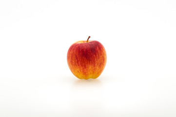 Single fresh red apple. Isolated on white background. Close-up.