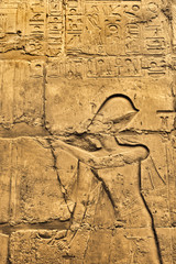 Ancient wall with Egyptian hieroglyphs in the Karnak Temple