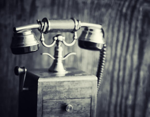 Old telephone and retro book on the desk. The phone of the past 