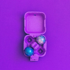 crazy magic dragon eggs with cosmic pattern in purple box. art creative concept. minimal and surreal artwork