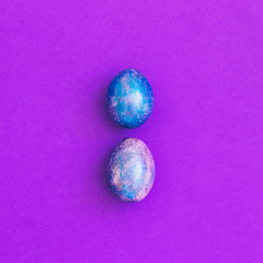 two crazy magic dragon eggs with cosmic pattern purple background. art creative concept. minimal and surreal artwork