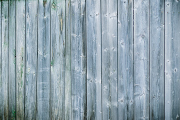 Blue and white background of weathered painted wooden plank