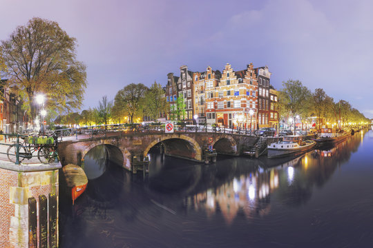 Canals of Amsterdam. Moody night panorama of Rossebuurt district