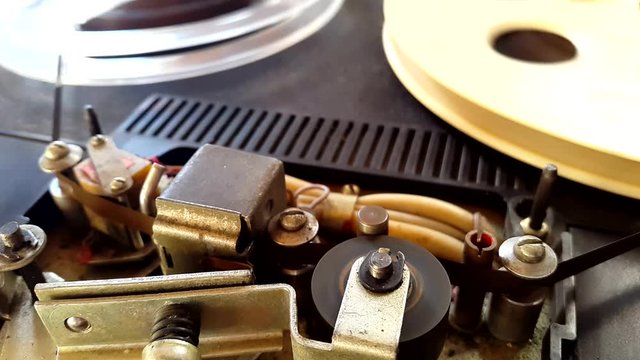 Old retro Reel Audio Recorder reels spinning