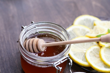 Fresh honey with a cup of black tea