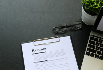 resume on wooden table in the modern office