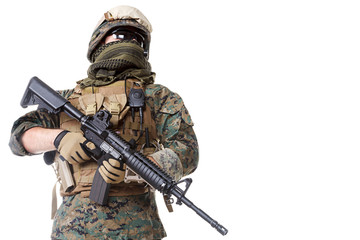 Studio shot of United States Marine with rifle weapons in uniforms. Proudly looking, low angle shot. Military equipment, army helmet, combat boots, tactical gloves. Isolated on white, weapons, army