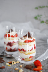 Dessert in a glass with chocolate and strawberries