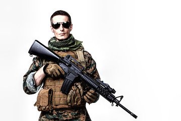 Studio shot of United States Marine with rifle weapons in uniforms. Military equipment, army helmet, combat boots, tactical gloves. Isolated on white, weapons, army, patriotism concept
