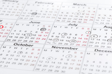 Fototapeta premium Closeup of dates on calendar page