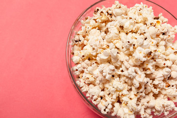 popcorn on color background