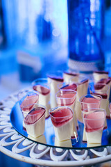 Close view of a piece of a colorful jelly cake with fruits