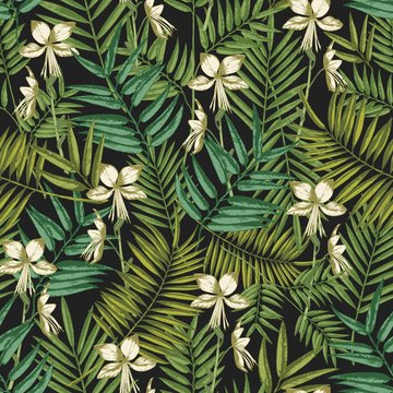 Elegant Hawaiian seamless pattern with exotic palm tree leaves and flowers on black background. Natural backdrop with foliage of tropical jungle plants. Colorful vector illustration for textile print.