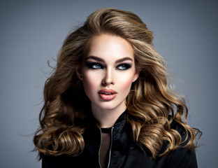 Beautiful blonde girl with  makeup in style smoky eyes.