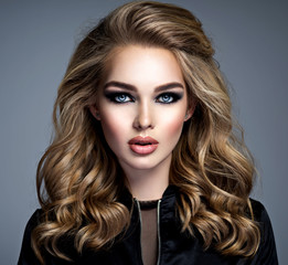 Beautiful blonde girl with  makeup in style smoky eyes.