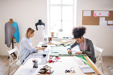 Young creative women in a studio, startup business.