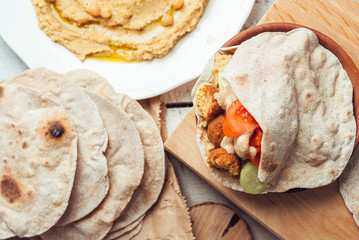 Falafel with humus and tahini in pita