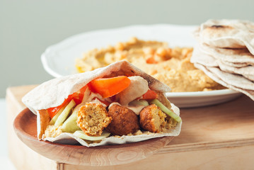 Falafel with humus and tahini in pita
